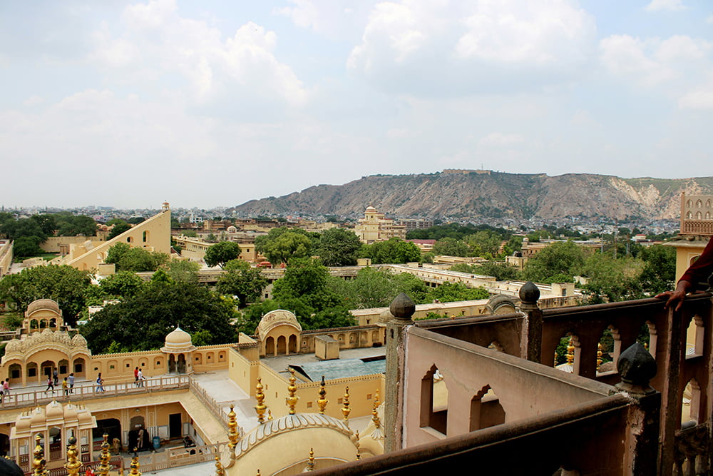 Panoramic view of Jaipur cityscape with historic buildings and hills in the background